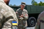 Army Gen. Daniel Hokanson, chief, National Guard Bureau, talks with a member of the Armed Forces of Ukraine in Grafenwoehr, Germany, June 12, 2022. Germany was Hokanson’s second stop on a five-nation trip to recognize and strengthen National Guard relationships with European allies and partners.