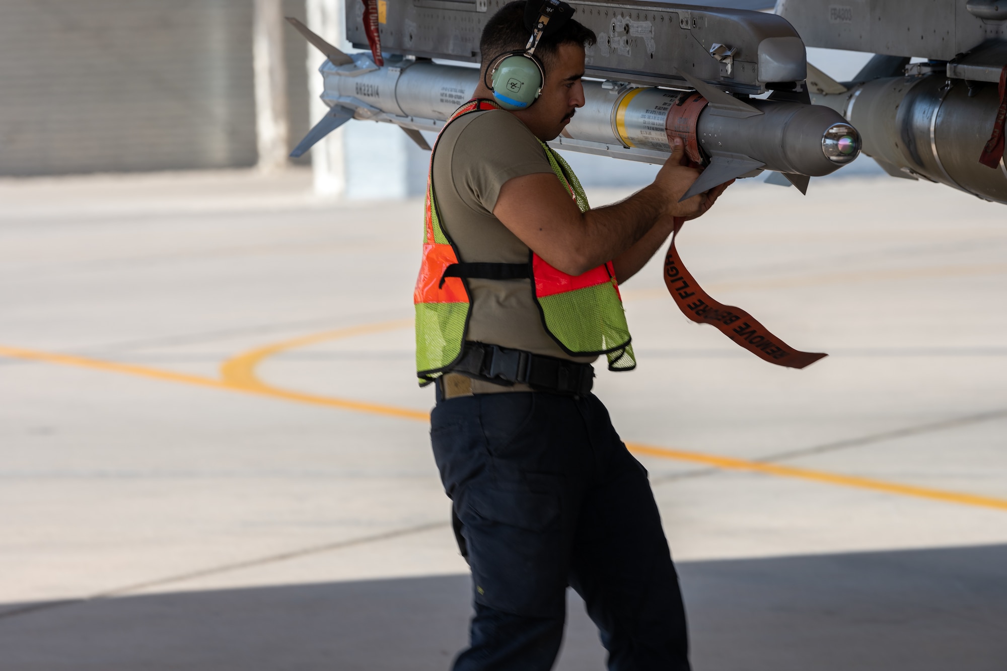 U.S. Air Force Senior Airman Kevin Monzon, a 77th Expeditionary Fighter Generation Squadron weapons load crew member conducts pre-flight inspection, prior to launching an F-16 Fighting Falcon sortie from Prince Sultan Air Base, Kingdom of Saudi Arabia.