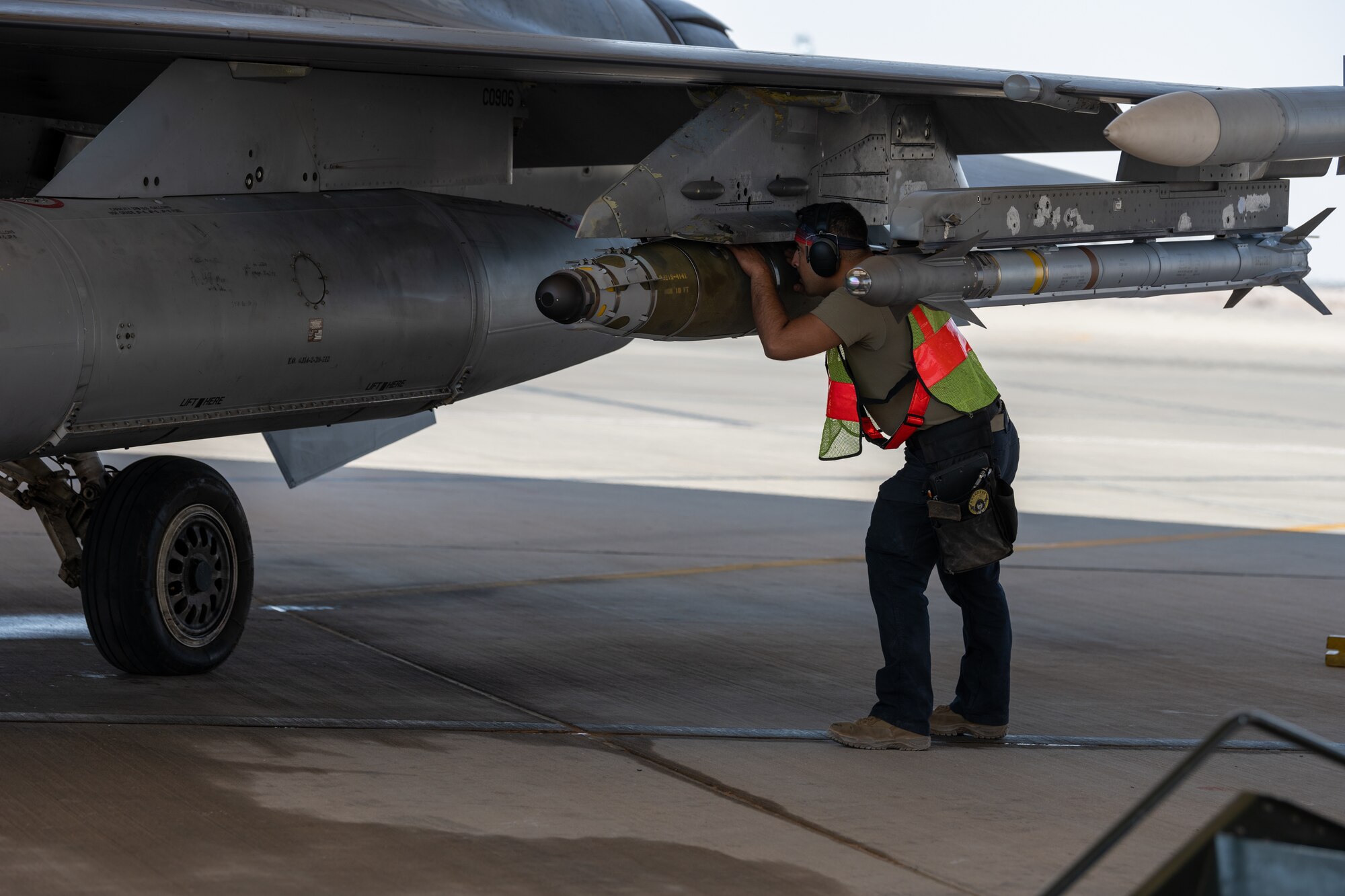 U.S. Air Force Senior Airman Kevin Monzon, a 77th Expeditionary Fighter Generation Squadron weapons load crew member conducts pre-flight inspection, prior to launching an F-16 Fighting Falcon sortie from Prince Sultan Air Base, Kingdom of Saudi Arabia.