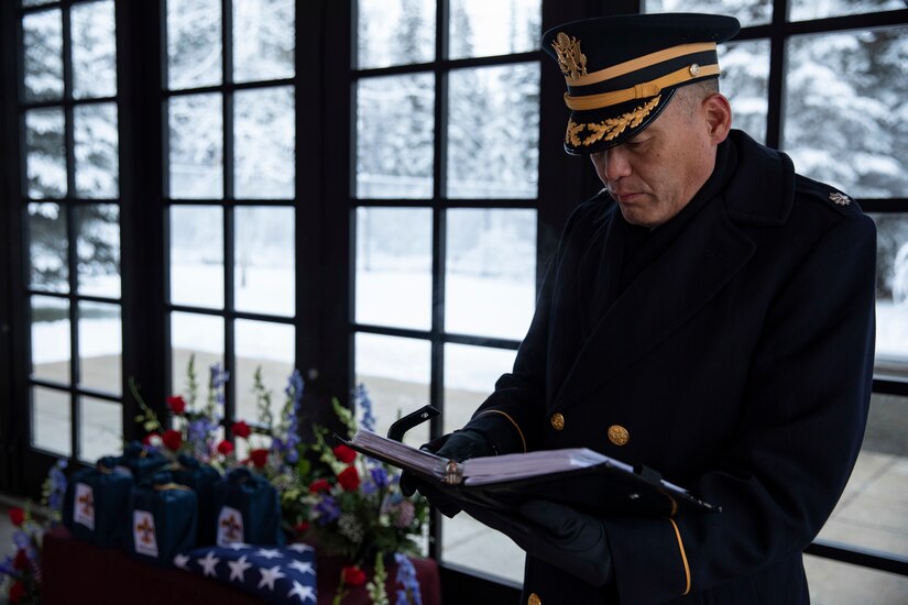 U.S Army Lt. Col. Eun Kim, deputy installation chaplain, officiates an unaccompanied funeral service for the remains of five veterans at the Fort Richardson National Cemetery on Joint Base Elmendorf-Richardson, Alaska, Nov. 30, 2022. The Department of Military and Veterans Affairs works jointly with the federally recognized non-profit organization Missing in American Project in locating, identifying and interring the unclaimed cremated remains of veterans with full honors and ceremony. (Alaska National Guard photo by Victoria Granado)