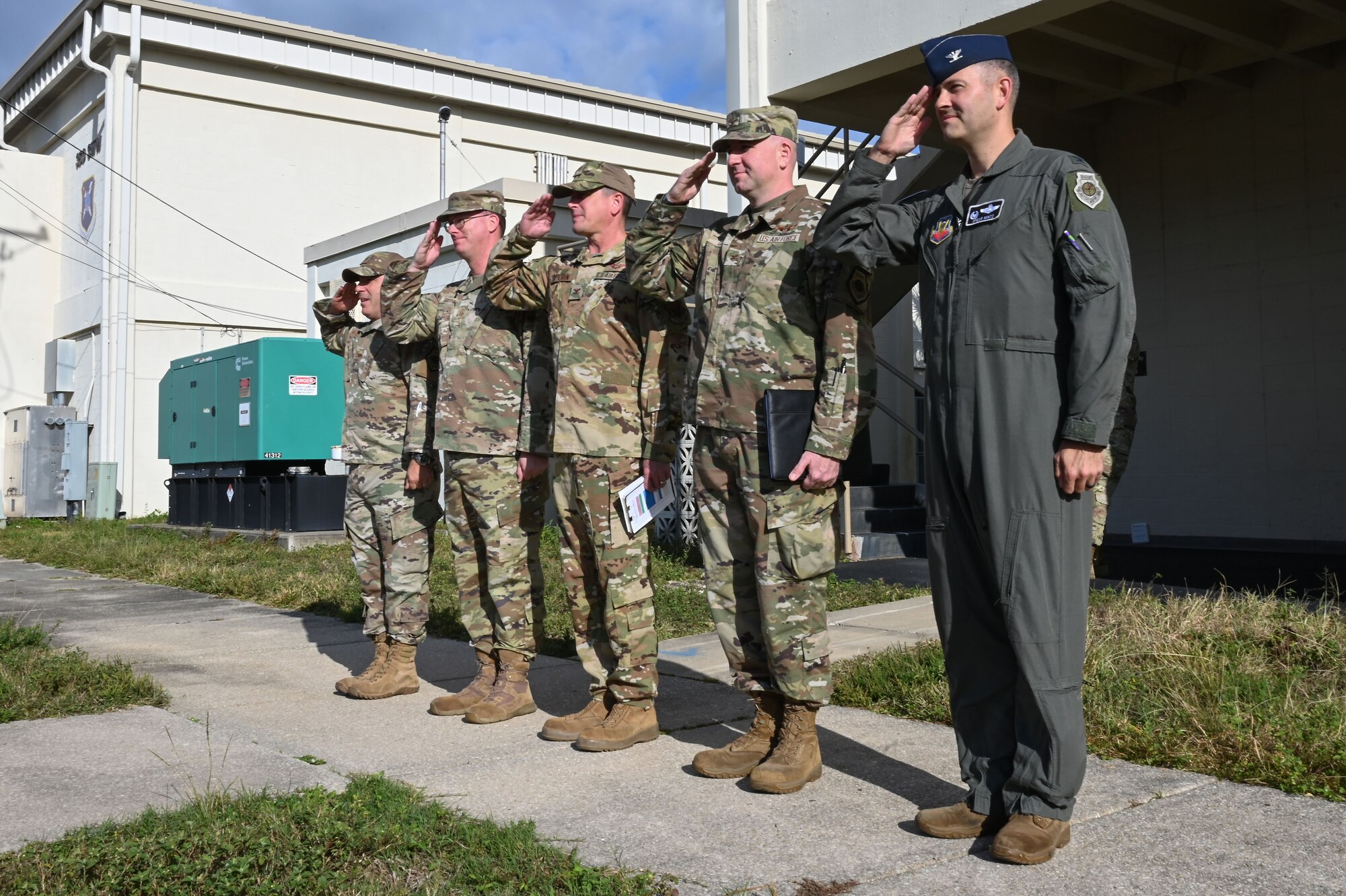 Leadership from the 350th Spectrum Warfare Wing salute U.S. Air Force Lt. Gen. David S. Nahom, commander of Alaskan NORAD Region, Alaskan Command and Eleventh Air Force, upon his arrival at Eglin Air Force Base, Fla., Nov. 28, 2022. The 350th SWW serves as the Air Force’s first Electromagnetic Spectrum (EMS) focused wing focused on enhancing air component commanders’ ability to synchronize, integrate and execute EMS capabilities across all domains and platforms. (U.S. Air Force photo by Staff Sgt. Ericka A. Woolever)