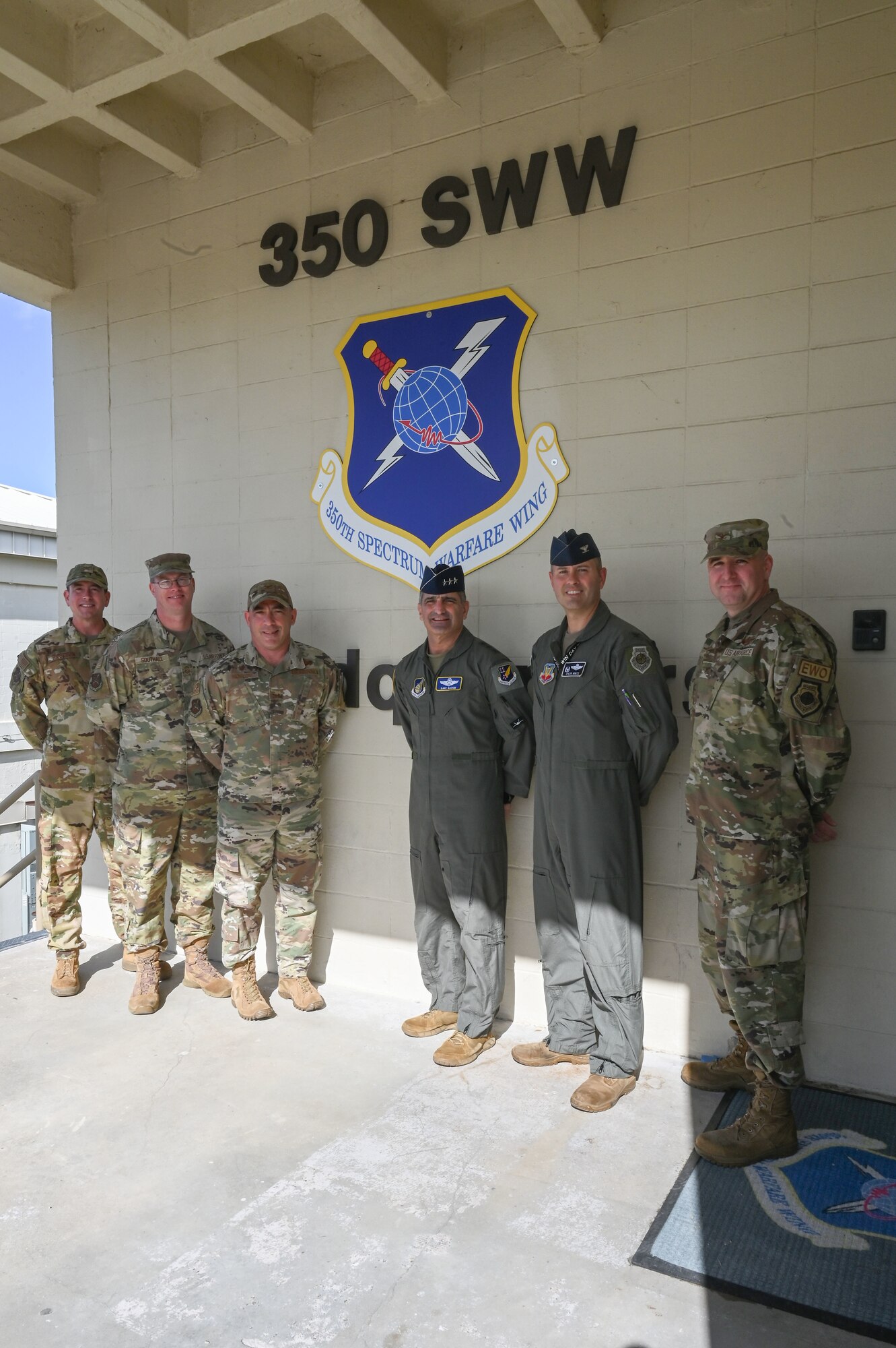 Leadership from the 350th Spectrum Warfare Wing and U.S. Air Force Lt. Gen. David S. Nahom, commander of Alaskan NORAD Region, Alaskan Command and Eleventh Air Force, pose for a photo at Eglin Air Force Base, Fla., Nov. 28, 2022. The 350th SWW delivers adaptive and cutting-edge Electromagnetic Spectrum capabilities that provide the warfighter a tactical and strategic competitive advantage and freedom to attack, maneuver, and defend. (U.S. Air Force photo by Staff Sgt. Ericka A. Woolever)