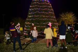 People take photos by the Christmas Tree on Beale Air Force Base, Calif., on Dec. 2, 2022.