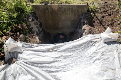 An expandable bellows plug is used to prevent any contaminated materials from entering the storm drain at the Red Hill Bulk Fuel Storage Facility (RHBFSF) in Halawa, Hawaii, Dec. 1, 2022.