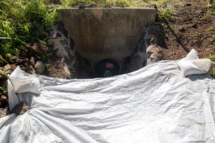 An expandable bellows plug is used to prevent any contaminated materials from entering the storm drain at the Red Hill Bulk Fuel Storage Facility (RHBFSF) in Halawa, Hawaii, Dec. 1, 2022.