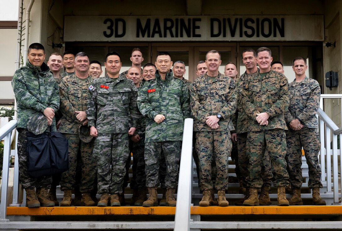 U.S. Marine Corps Maj. Gen. Jay M. Bargeron, 3d Marine Division Commanding General and 3d Marine Division staff pose for a group photo with Maj. Gen Im Sunggeun, Republic of Korea 1st Marine Division Commanding General and his staff at Camp Courtney, Okinawa, Japan, Nov. 28, 2022.