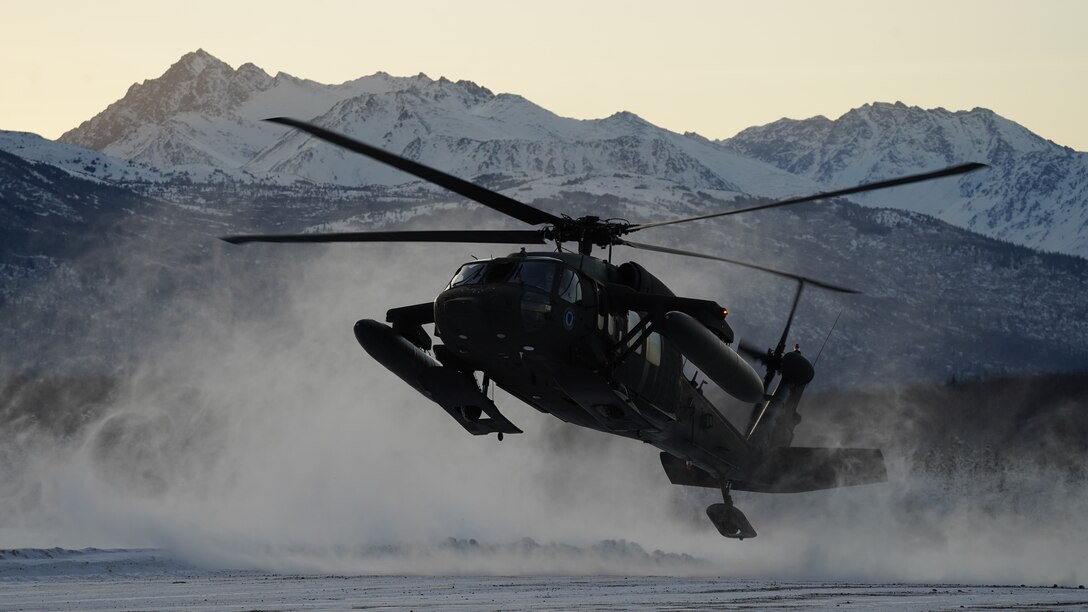 An Alaska Army National Guard UH-60L Black Hawk helicopter assigned to 1-207th Aviation Regiment makes a tactical insertion at Malemute drop zone on Joint Base Elmendorf-Richardson, Alaska, Dec. 2. The air crew conducted air assault training with the University of Alaska ROTC detachment during its end-of-semester training exercise. The Alaska Army National Guard’s General Support Aviation Battalion routinely trains with all branches of the military as well as civilian agencies to increase its operational interoperability and to be ready for a wide range of federal and state missions.