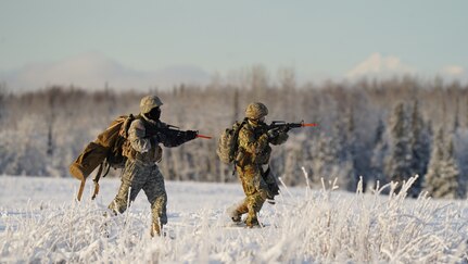 University of Alaska Army ROTC cadets bound towards their objective after unloading from an Alaska Army National Guard UH-60L Black Hawk helicopter assigned to 1-207th Aviation Regiment during an air assault training event at Joint Base Elmendorf-Richardson, Alaska, Dec. 2. The Seawolf ROTC Detachment maneuvered across more than one mile of frozen terrain to assault opposition forces and secure its objective. The Alaska Army National Guard’s General Support Aviation Battalion routinely trains with all branches of the military as well as civilian agencies to increase its operational interoperability and to be ready for a wide range of federal and state missions.