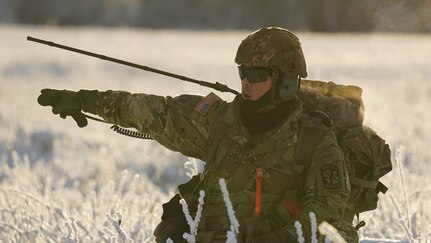 University of Alaska Army ROTC Cadet Ralph Sumagang gives movement commands to his squad members during an air assault training event at Joint Base Elmendorf-Richardson, Alaska, Dec. 2. The Seawolf ROTC Detachment maneuvered across more than one mile of frozen terrain to assault opposition forces and secure its objective. The Alaska Army National Guard’s General Support Aviation Battalion routinely trains with all branches of the military as well as civilian agencies to increase its operational interoperability and to be ready for a wide range of federal and state missions.