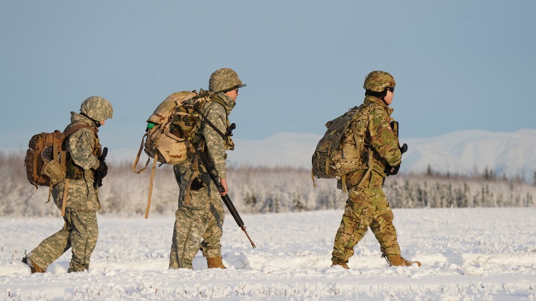 University of Alaska Army ROTC cadets move to the designated landing zone on the Malemute drop zone on Joint Base Elmendorf-Richardson Alaska, Dec. 2, as an Alaska Army National Guard UH-60L Black Hawk helicopter assigned to 1-207th Aviation Regiment approaches to conduct an extraction. The Seawolf ROTC Detachment maneuvered across more than one mile of frozen terrain to assault opposition forces and secure its objective. The Alaska Army National Guard’s General Support Aviation Battalion routinely trains with all branches of the military as well as civilian agencies to increase its operational interoperability and to be ready for a wide range of federal and state missions.