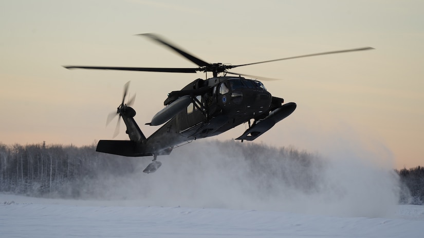 An Alaska Army National Guard UH-60L Black Hawk helicopter assigned to 1-207th Aviation Regiment makes a tactical insertion at the Malemute drop zone on Joint Base Elmendorf-Richardson, Alaska, Dec. 2. The air crew conducted air assault training with the University of Alaska ROTC detachment during its end-of-semester training exercise. The Alaska Army National Guard’s General Support Aviation Battalion routinely trains with all branches of the military as well as civilian agencies to increase its operational interoperability and to be ready for a wide range of federal and state missions.
