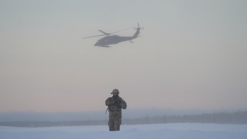 Alaska Army National Guard Capt. Danny Canlas, University of Alaska- Anchorage assistant professor of Military Science, observes the cadets from the Seawolf ROTC Detachment as an Alaska Army National Guard UH-60L Black Hawk helicopter assigned to 1-207th Aviation Regiment departs the Malemute drop zone on Joint Base Elmendorf-Richardson. The Seawolf Detachment conducted air assault operations as part of its end-of-semester training exercise. The Alaska Army National Guard’s General Support Aviation Battalion routinely trains with all branches of the military as well as civilian agencies to increase its operational interoperability and to be ready for a wide range of federal and state missions.