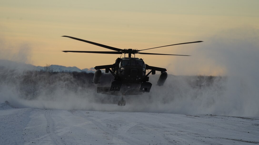 An Alaska Army National Guard UH-60L Black Hawk helicopter assigned to 1-207th Aviation Regiment makes a tactical insertion at Malemute drop zone on Joint Base Elmendorf-Richardson, Alaska, Dec. 2.  The air crew conducted air assault training with the University of Alaska ROTC detachment during its end-of-semester training exercise. The Alaska Army National Guard’s General Support Aviation Battalion routinely trains with all branches of the military as well as civilian agencies to increase its operational interoperability and to be ready for a wide range of federal and state missions.