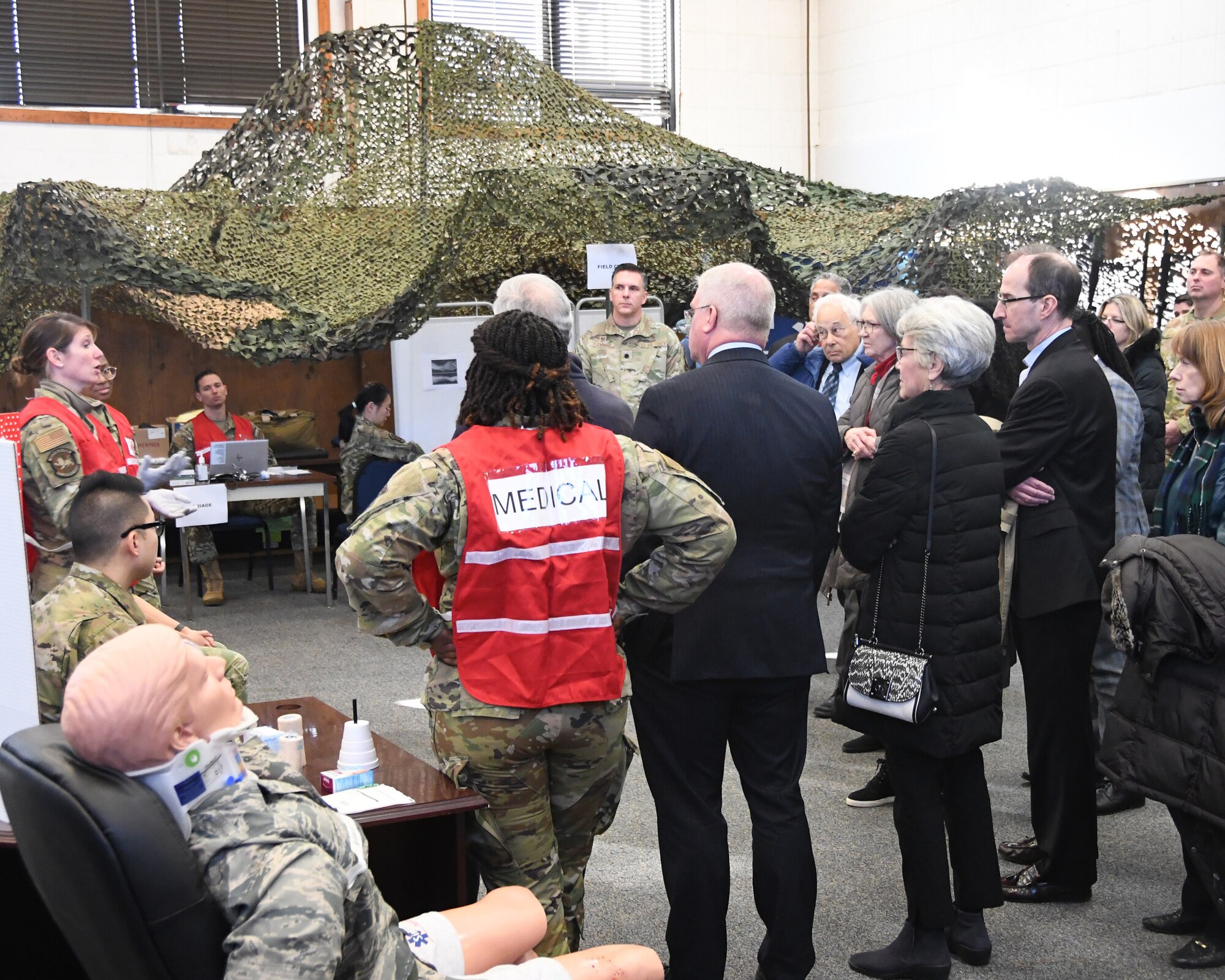 Maj. Sarah King, 459th Aerospace Medicine Squadron Nurse (far left), talks to Defense Health Board members about patient care within the 459th AMDS mission during the board’s visit to the 459th ARW on Dec. 1, 2022. The DHB requested a visit to Joint Base Andrews for an opportunity to see the pivotal role medical units at Joint Base Andrews play in the global patient movement pipeline and the challenges faced in supporting this critical effort. (U.S. Air Force Photo by Maj. Tim Smith)