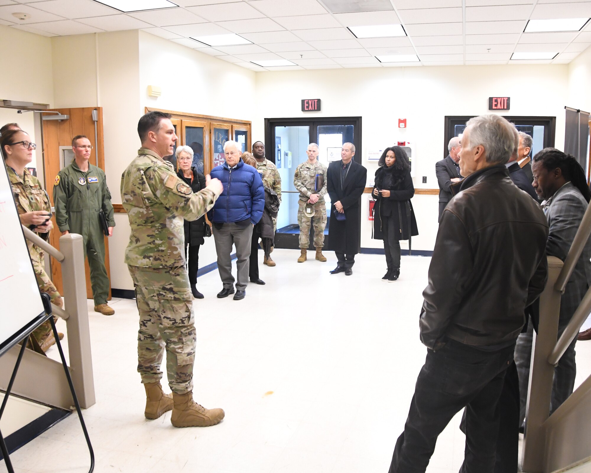 Lt. Col. Robert Flemming, 459th Aerospace Medicine Squadron Commander, prepares Defense Health Board members for an ensuing 459th AMDS medical demonstration during their visit to the 459th ARW on Dec. 1, 2022. The DHB requested a visit to Joint Base Andrews for an opportunity to see the pivotal role medical units at Joint Base Andrews play in the global patient movement pipeline and the challenges faced in supporting this critical effort. (U.S. Air Force Photo by Maj. Tim Smith)