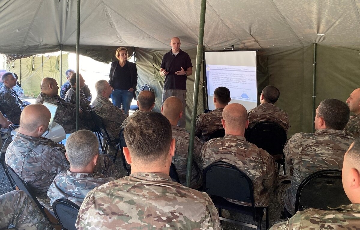 OSI Forensic Science Consultant Michael Buckley, 4th Field Investigations Squadron Vogelweh Cantonment, Germany, explains Locard’s exchange principle’s connection to evidence collection to Georgian Military Police. (Photo courtesy SA Mark Ryan, FPD Tbilisi, Georgia)