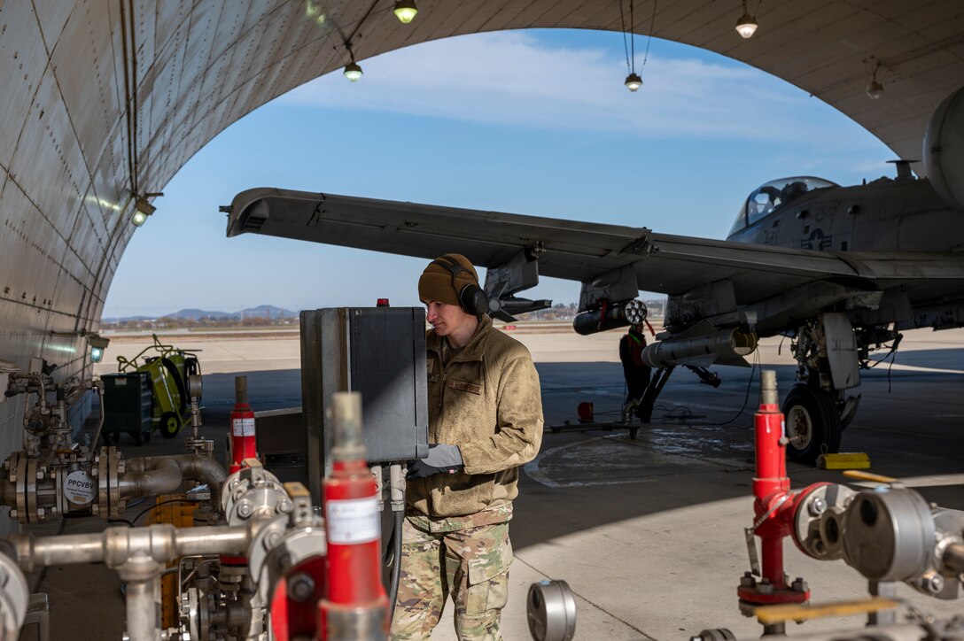 U.S. Air Force Airman 1st Class Jeremy Walter, 51st Logistics Readiness Squadron fuels distribution operator records fuel levels during a hot-pit refueling of an A-10 Thunderbolt II at Osan Air Base, Republic of Korea, Nov. 30 2022.