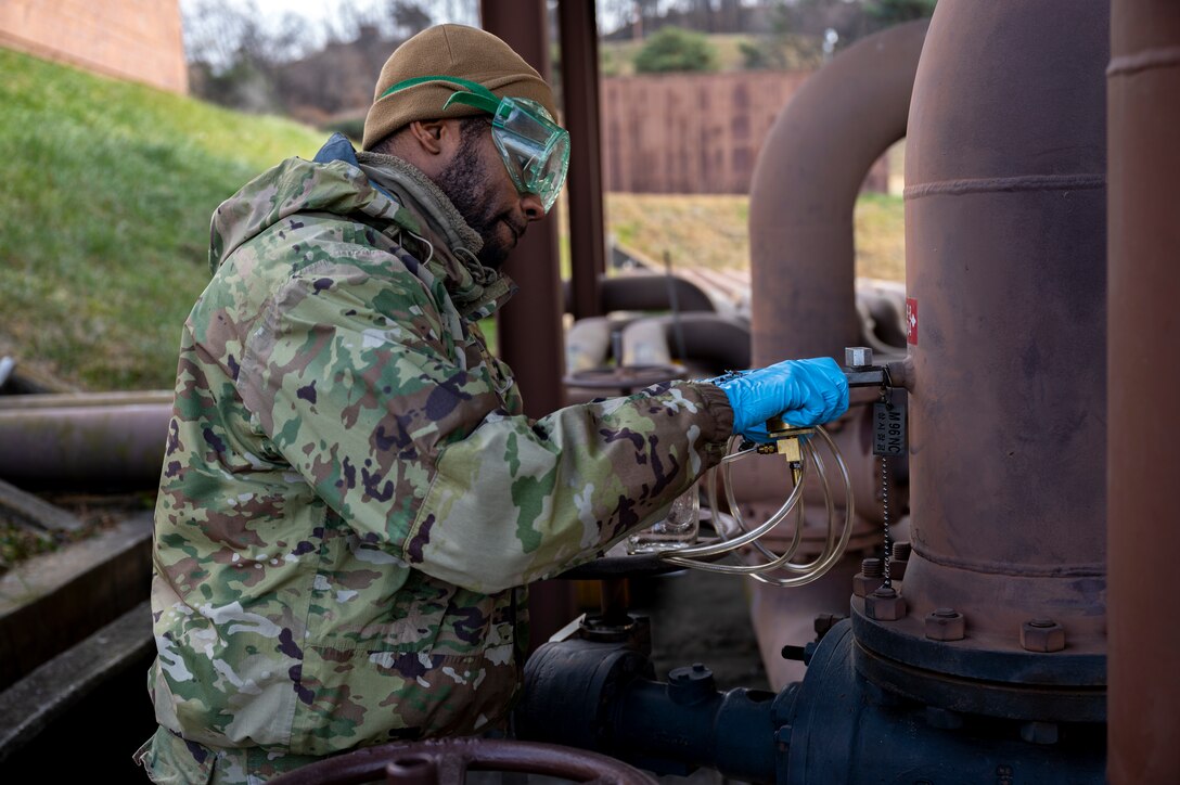 U.S. Air Force Airman 1st Class Gabriel Neloms, 51st Logistics Readiness Squadron fuels laboratory technician performs tests on JP-8 fuel at Osan Air Base, Republic of Korea, Nov. 30 2022.