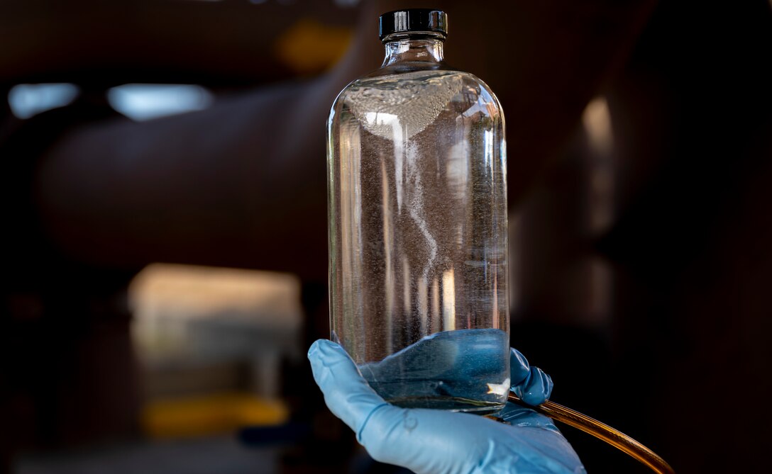 U.S. Air Force Airman 1st Class Gabriel Neloms, 51st Logistics Readiness Squadron fuels laboratory technician conducts a visual test on JP-8 fuel at Osan Air Base, Republic of Korea, Nov. 30 2022.