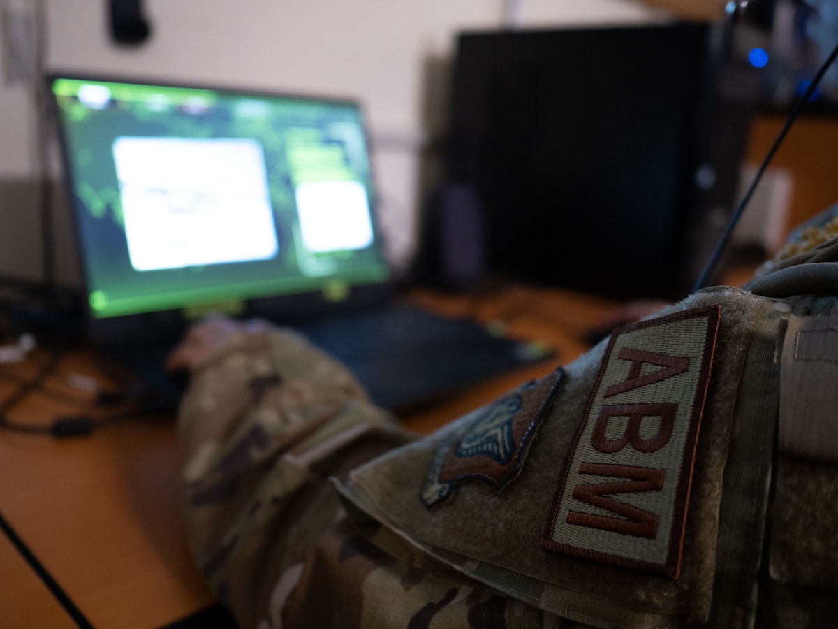 1st Lt. Sheldon Lee, 169th Air Defense Squadron air battle manager, operates an electronic training system Oct. 1, 2022, at Wheeler Army Air Field, Hawaii. Lee was named the overall champion of a career-field-wide training competition utilizing an artificial intelligence-based training platform that simulates the activities of an air-to-air engagement and serves as a cost-effective means for users to develop their command-and-control competencies
