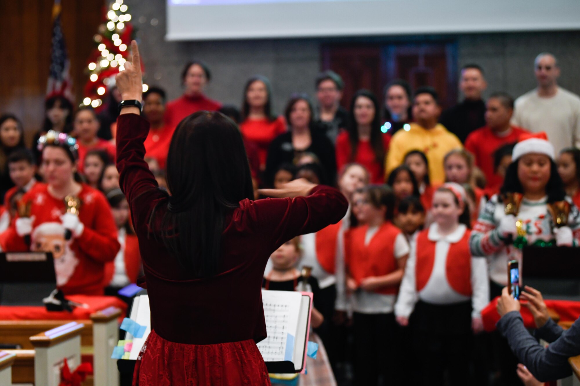 A conductor leads a choir.