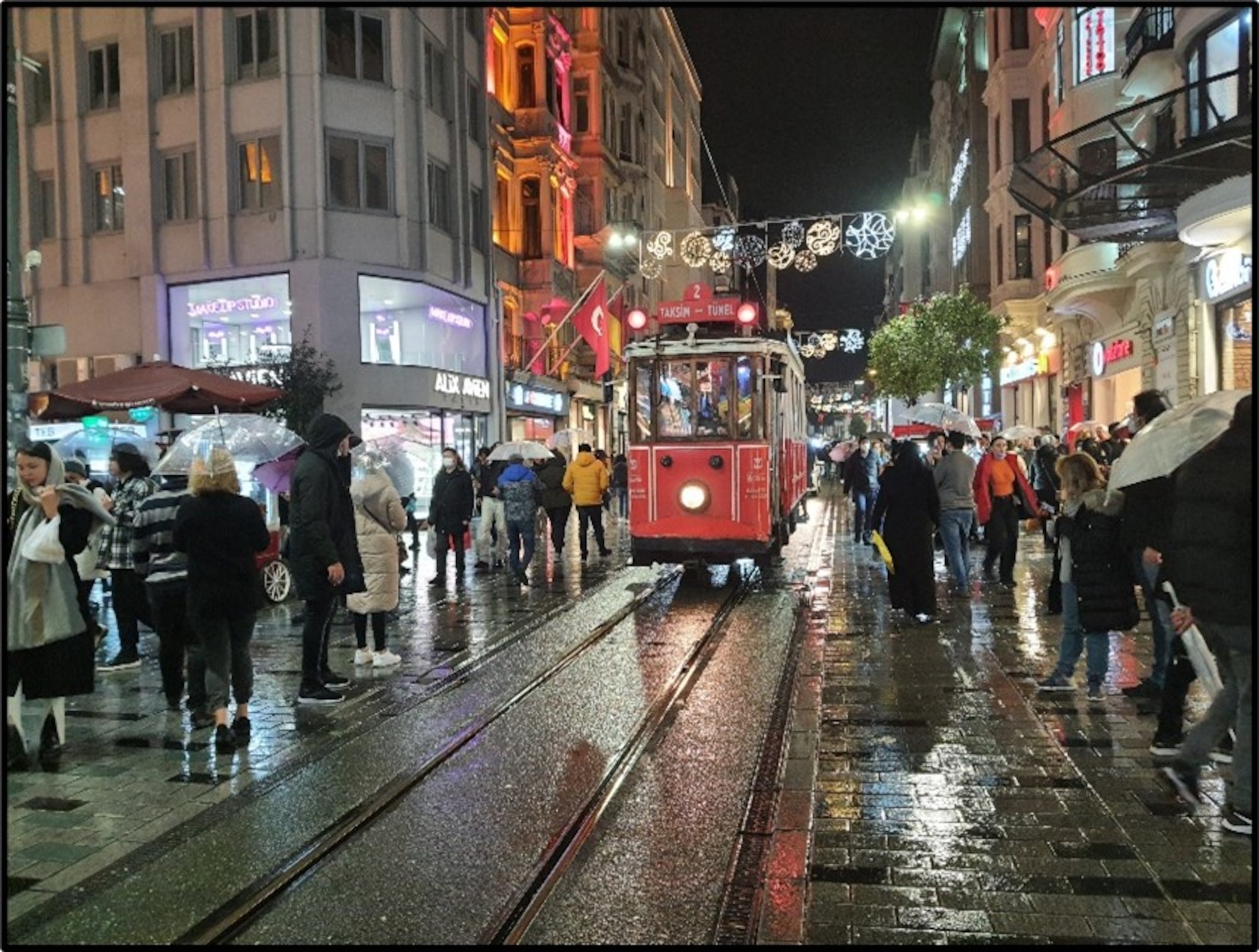 A cable car runs in the middle of the street taking passengers down to the end of İstiklal Street starting from the city center ‘Taksim Square’ in a rainy day in Istanbul Dec. 29, 2021. (U.S. Air Force photo by Tanju Varlıklı)