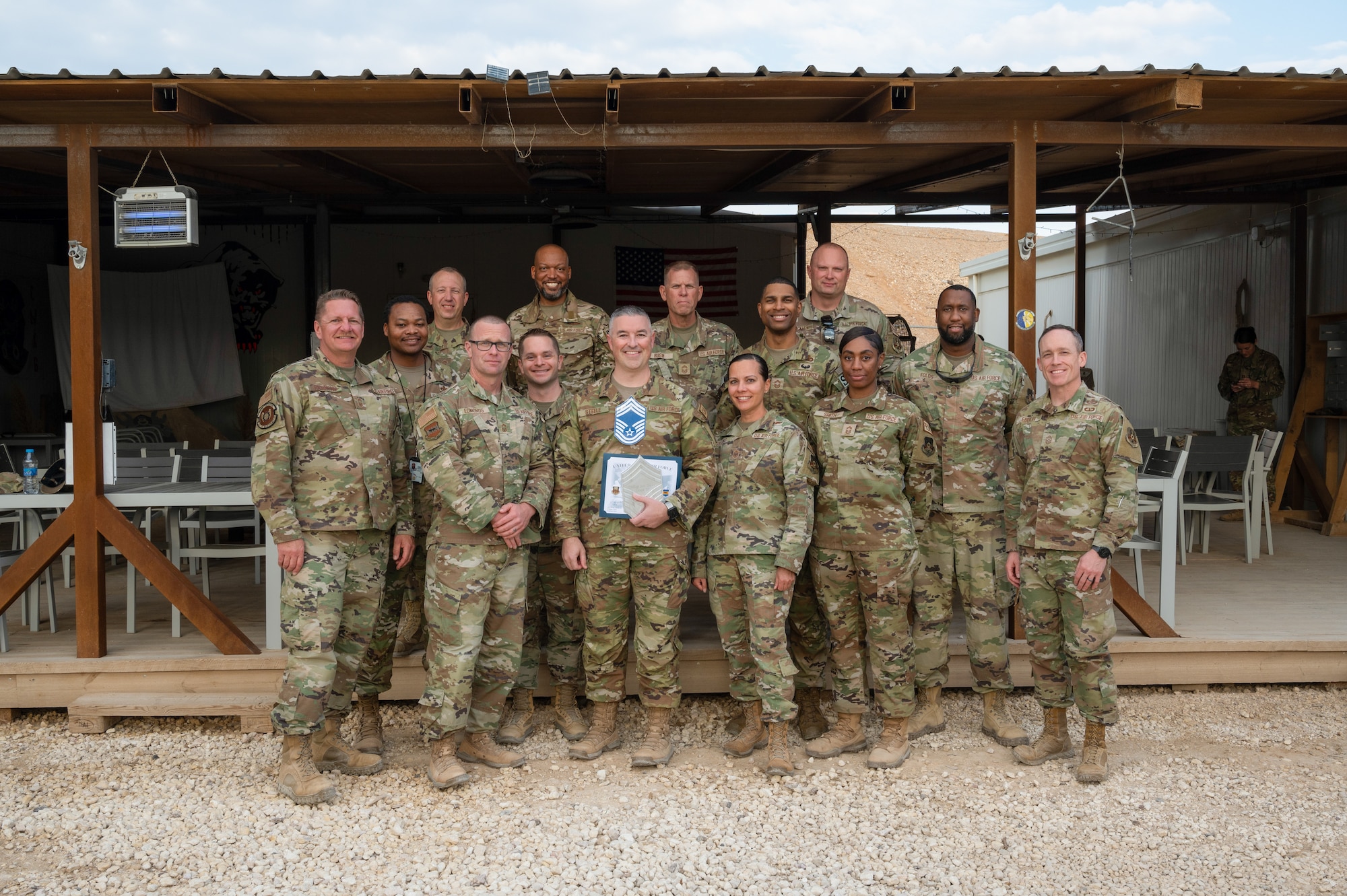 U.S. Air Force Chief Master Sgt. select Jonathan M. Steele, 332d Air Expeditionary Wing A4 Quality Assurance Division Chief (center), poses with other Chief Master Sergeants. during a promotion recognition at an undisclosed location, Southwest Asia, Tuesday, Dec. 5, 2020. Steele will officially put on rank in early 2023. (U.S. Air Force photo by Tech. Sgt. Richard Mekkri)
