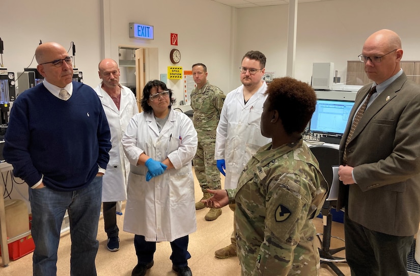 Army Col. Crystal Hills, the commander of the 405th Army Field Support Brigade, addresses employees at the 405th AFSB’s Army Oil Analysis Program Laboratory Europe at the Kaiserslautern Army Depot, Dec. 5. The mission of the 405th AFSB’s AOAP lab is to provide and execute AOAP for U.S. European Command and U.S. Africa Command by supporting warfighters with the most technological advanced diagnostic tools capable of worldwide mobilization for detecting impending failures in oil wetted components before catastrophic failures occur. (Photo by Sgt. 1st Class Guido Fermin)