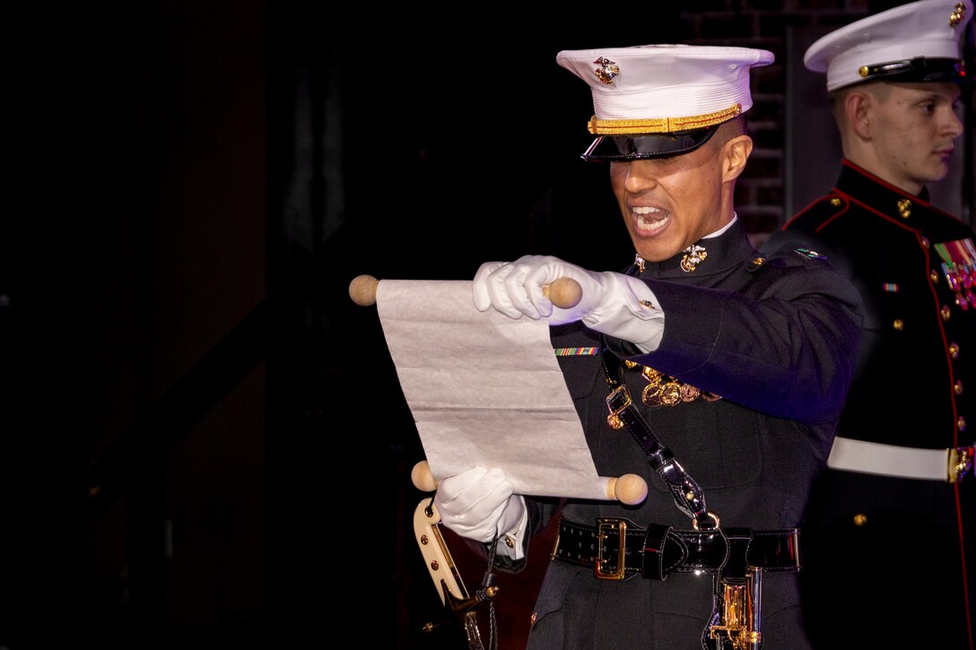 Capt. Efrain Melecio, with Marine Corps Recruiting Station St. Louis, reads a message from the 13th commandant of the Marine Corps, Gen. John A. Lejeune, as part of the cake cutting ceremony during the Marine Corps Birthday Ball at Bally Sports Live! in downtown St. Louis, on Nov. 11. The Marine Corps Birthday Ball is a time honored tradition that includes a ceremony, speeches from the guest of honor and the commanding officer, among other festivities. (U.S. Marine Corps Photo by Sgt. Jacob Foster)