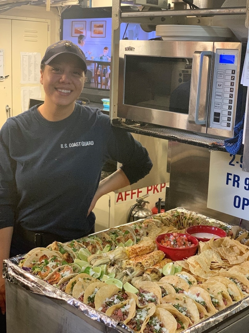 Chief Petty Officer Ava Stow cooks aboard the Coast Guard Cutter Dolphin, May 2019 (Photo courtesy of Chief Petty Officer Stow).