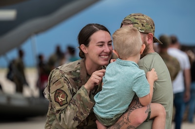 Servicewoman greets family