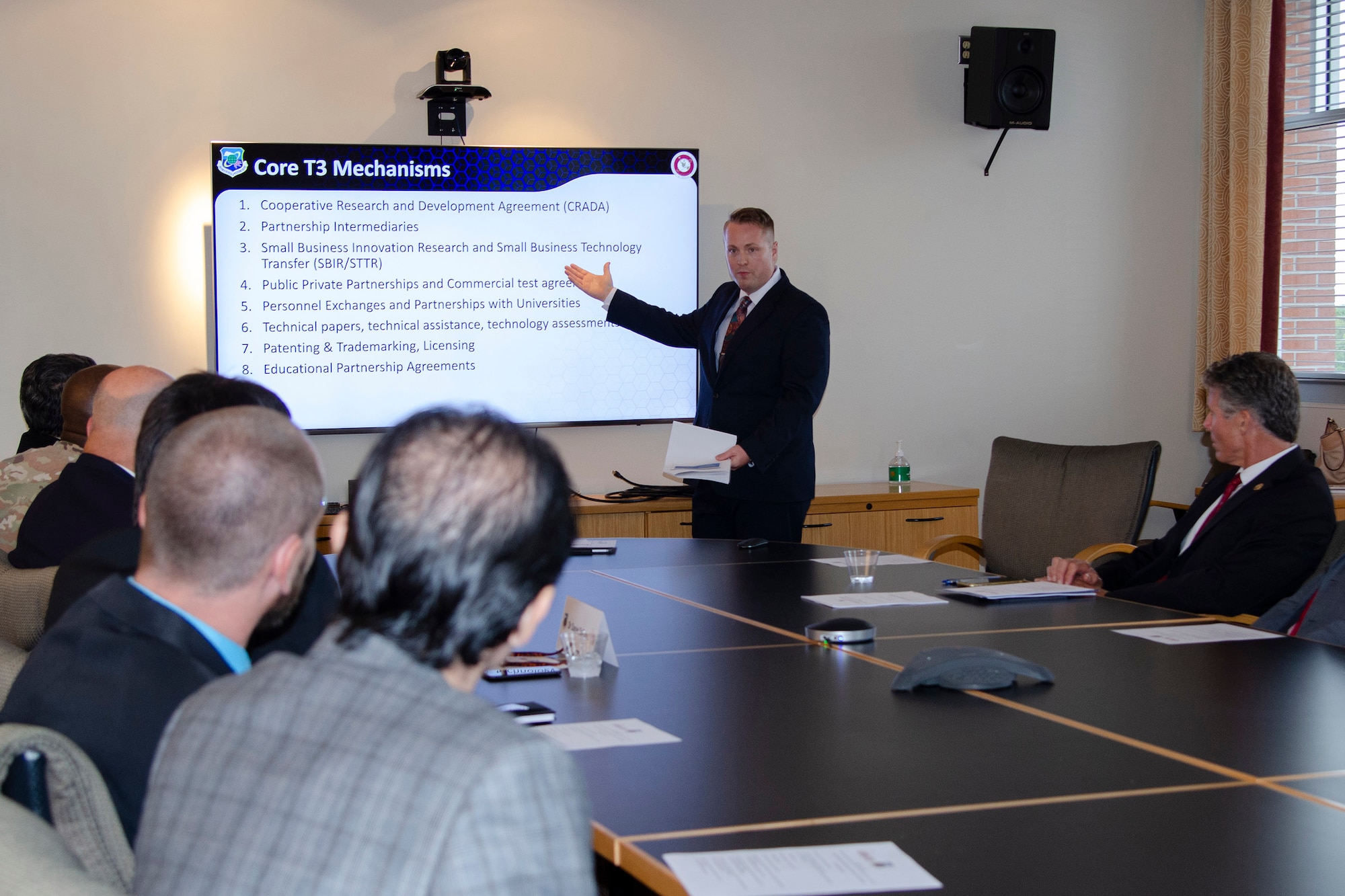 Jonathan Holton, Deputy Branch Chief of Research and Development Relationships and Manager for Office of Research and Technology at the Air Force Technical Applications Center, briefs executives from Florida Institute of Technology Nov. 15, 2022, about the details of AFTAC’s Cooperative Research and Development Agreement with the university.  A CRADA is government contract that allows for R&D collaboration between federal laboratories and non-federal entities to provide quick, unique access to extensive government-funded research that can be leveraged by both parties to yield powerful, scientific results.  (U.S. Air Force photo by Susan A. Romano)