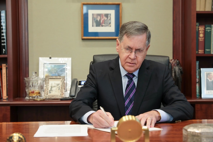 Ambassador David M. Satterfield, director, Rice University’s Baker Institute for Public Policy, signs the Memorandum of Understanding that seals a partnership between the University and the U.S. Army Civil Affairs and Psychological Operations Command (Airborne) in the office of former United States Secretary of State and White House Chief of Staff James Baker, III, at the Baker Institute, Houston, Texas, on November 28, 2022.  The MOU is aimed at providing additional training opportunities to the U.S. Army Reserve’s Military Government Specialists (38G).  (US Army Reserve photo by Sgt. 1st Class Lisa M Litchfield)