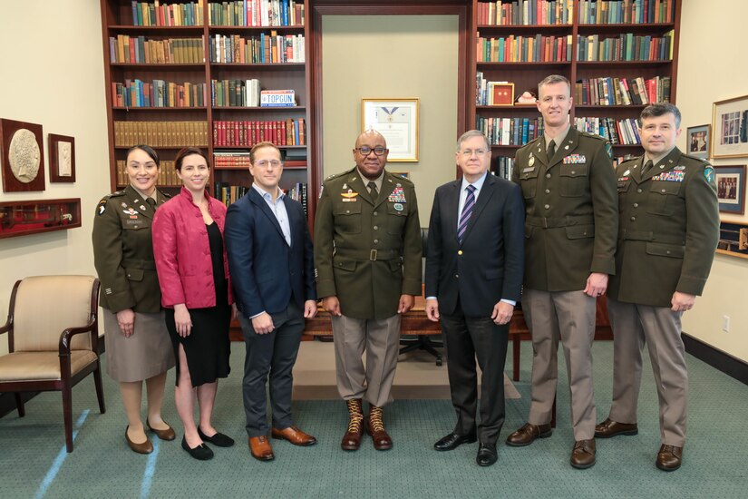 Maj. Gen. Isaac Johnson, Jr., commanding general, U.S. Army Civil Affairs and Psychological Operations Command (Airborne) (center) and Ambassador David M. Satterfield(right of center), director at Rice University’s Baker Institute for Public Policy, pose with USACAPOC(A) Soldiers after signing a Memorandum of Understanding, November 28, 2022. The MOU is aimed at providing additional training opportunities to the U.S. Army Reserve’s Military Government Specialists (38G).  (US Army Reserve photo by Sgt. 1st Class Lisa M Litchfield)