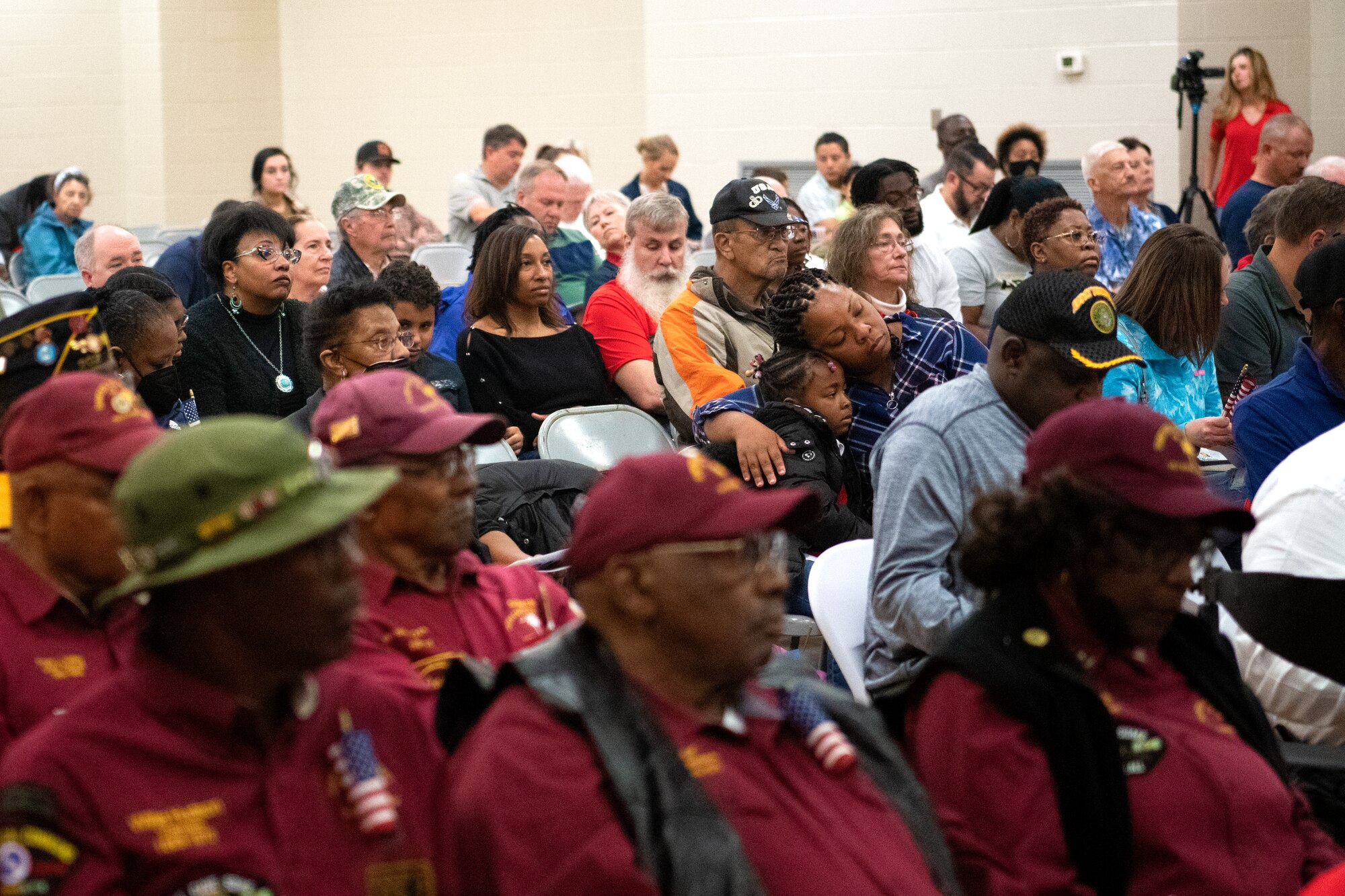 Members of the Sumter and Shaw communities attend a Veterans Day ceremony in Sumter, S.C., Nov. 11, 2022. While normally the ceremony would take place in front of the Sumter County courthouse after a parade, this year it was held indoors due to inclement weather. (U.S. Air Force photo by Staff Sgt. Kelsey Owen)