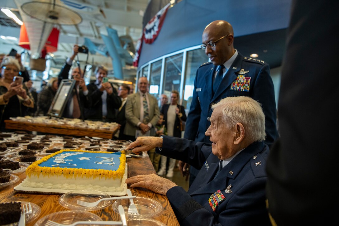 Retired Brig. Gen. Clarence E. “Bud” Anderson cuts a celebratory cake after an honorary promotion ceremony presided over by Air Force Chief of Staff Gen. CQ Brown, Jr. at the Aerospace Museum of California in McClellan, Calif., Dec. 2, 2022. The ceremony was an opportunity to honor the 100-year-old World War II triple ace during the 75th anniversary year of the U.S. Air Force’s establishment as a military service. (U.S. Air Force photo by Nicholas Pilch)