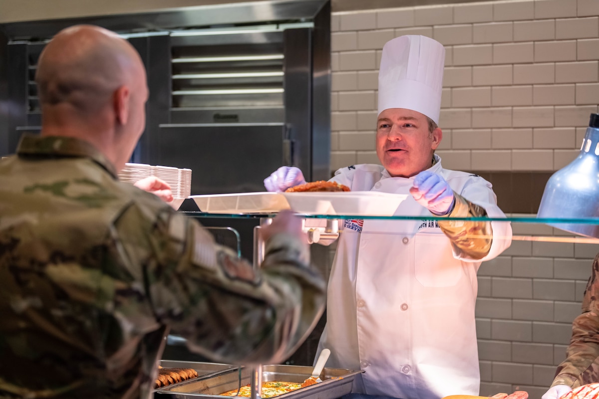 349 AMW Leadership Serve Hungry Airmen at the dining facility over the December drill weekend to show their appreciation