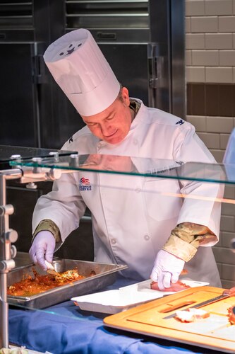 349 AMW Leadership Serve Hungry Airmen at the dining facility over the December drill weekend to show their appreciation