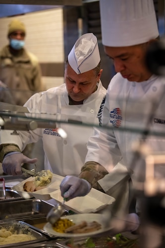 349 AMW Leadership Serve Hungry Airmen  at the dining facility over the December drill weekend to show their appreciation