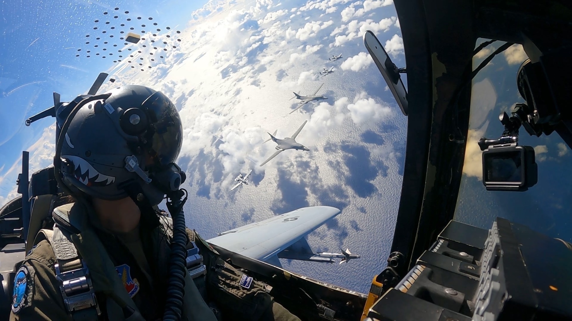 10C Thunderbolt II pilot, flies near a formation of B1-B Lancer and A-10 aircraft above the Philippine Sea