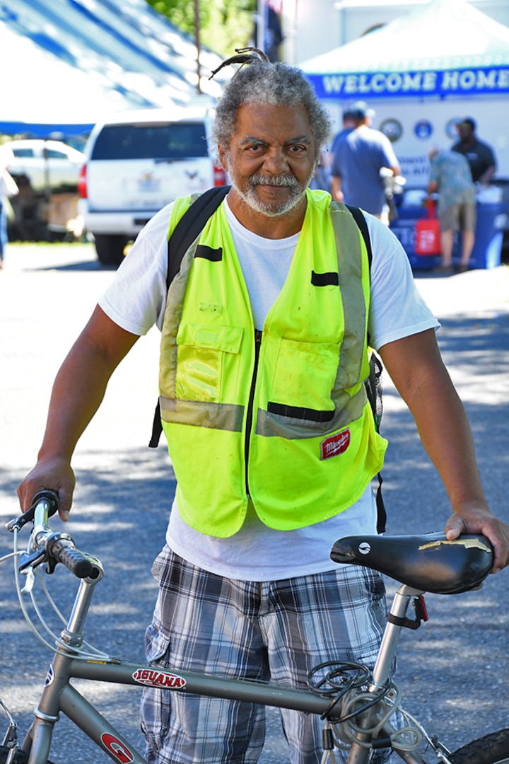 A veteran poses with his bike.