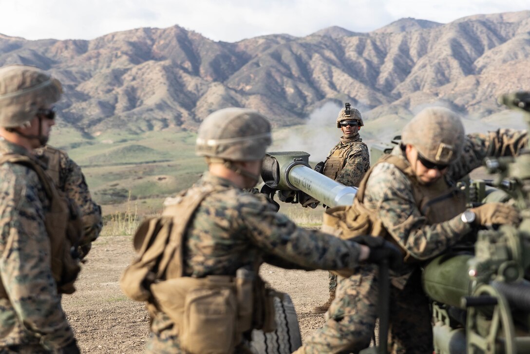 U.S. Marines with India Battery, 1st Battalion, 11th Marine Regiment, 1st Marine Division, prepare an M777A2 lightweight 155mm howitzer for towing during a direct fire training exercise as part of Steel Knight 23 at Marine Corps Base Camp Pendleton, California, Dec. 5, 2022. Steel Knight is an annual combined arms live-fire exercise which ensures 1st MARDIV is optimized for naval expeditionary warfare in contested spaces, and is purpose-built to facilitate future operations afloat and ashore. (U.S. Marine Corps photo by Cpl. Hermanet)