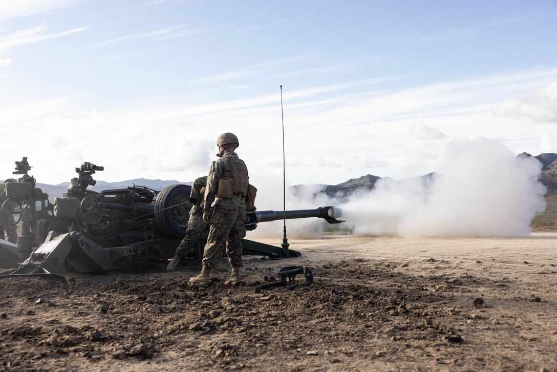 U.S. Marines with India Battery, 1st Battalion, 11th Marine Regiment, 1st Marine Division, fire an M777A2 lightweight 155mm howitzer during a direct fire training exercise as part of Steel Knight 23 at Marine Corps Base Camp Pendleton, California, Dec. 5, 2022. Steel Knight is an annual combined arms live-fire exercise which ensures 1st MARDIV is optimized for naval expeditionary warfare in contested spaces, and is purpose-built to facilitate future operations afloat and ashore. (U.S. Marine Corps photo by Cpl. Hermanet)
