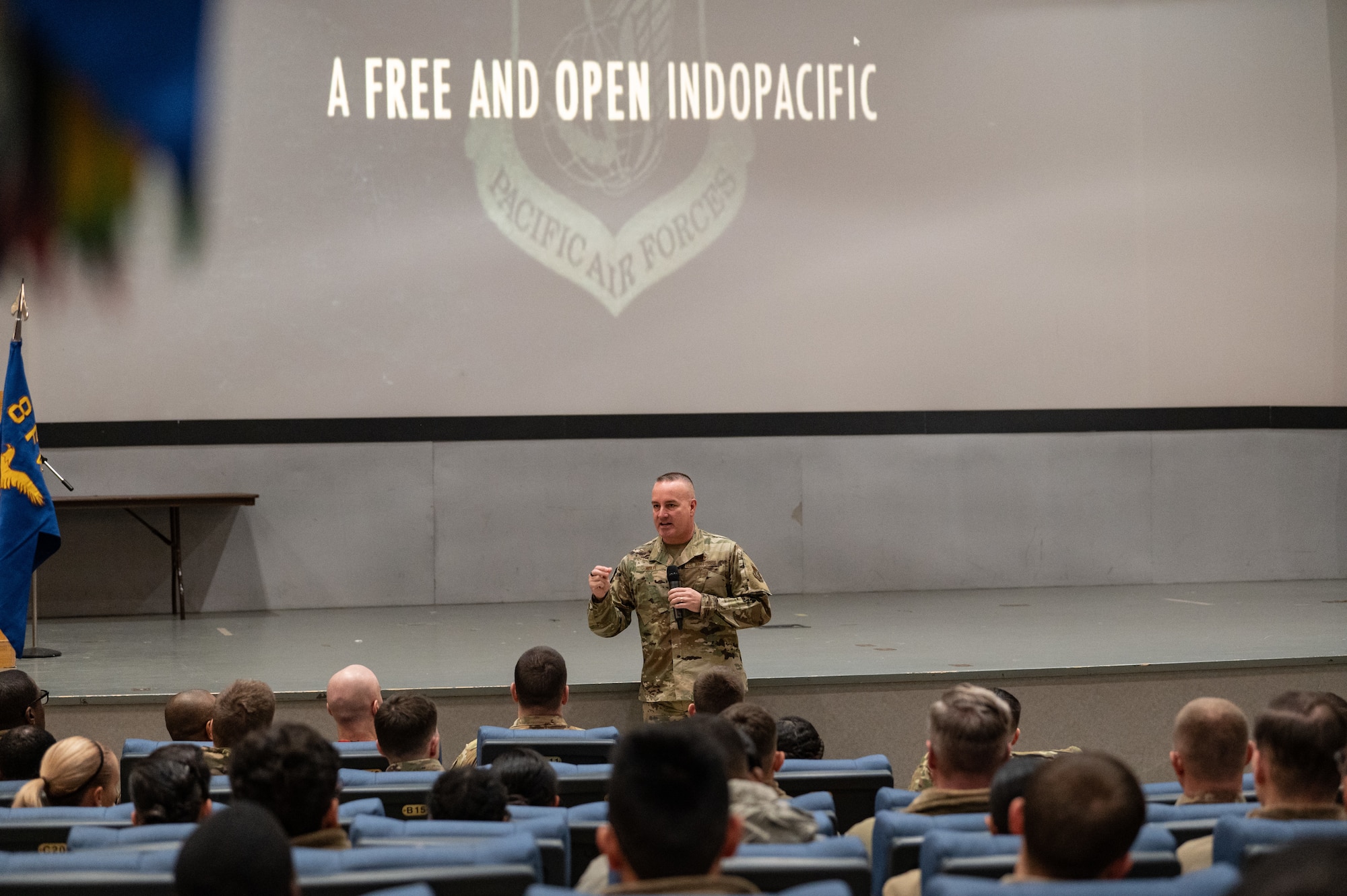 Chief Master Sgt. David R. Wolfe, Pacific Air Forces Command chief master sergeant, speaks during an all-call, at Kunsan Air Base, Republic of Korea, Dec. 5, 2022. Even with overseeing approximately 48,000 service members across the Indo-Pacific theater, Wolfe made time to address the Wolf Pack and relay his future goals for his PACAF personnel regarding training and resource utilization. (U.S. Air Force photo by Staff Sgt. Sadie Colbert)