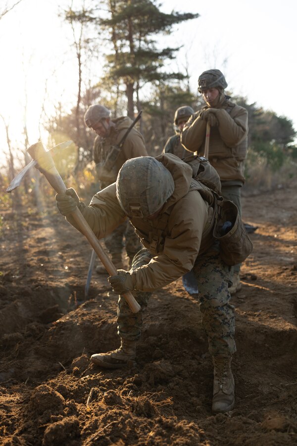 U.S. Marines with 3d Battalion, 12th Marines prepare fighting positions as part of live fire training during Artillery Relocation Training Program 22.3 at the Ojojihara Maneuver Area, Miyagi, Japan, Dec. 3, 2022. The skills developed at ARTP increase the proficiency and readiness of the only permanently forward-deployed artillery unit in the Marine Corps, enabling them to provide precision indirect fires. (U.S. Marine Corps photo by Lance Cpl Eduardo Delatorre)