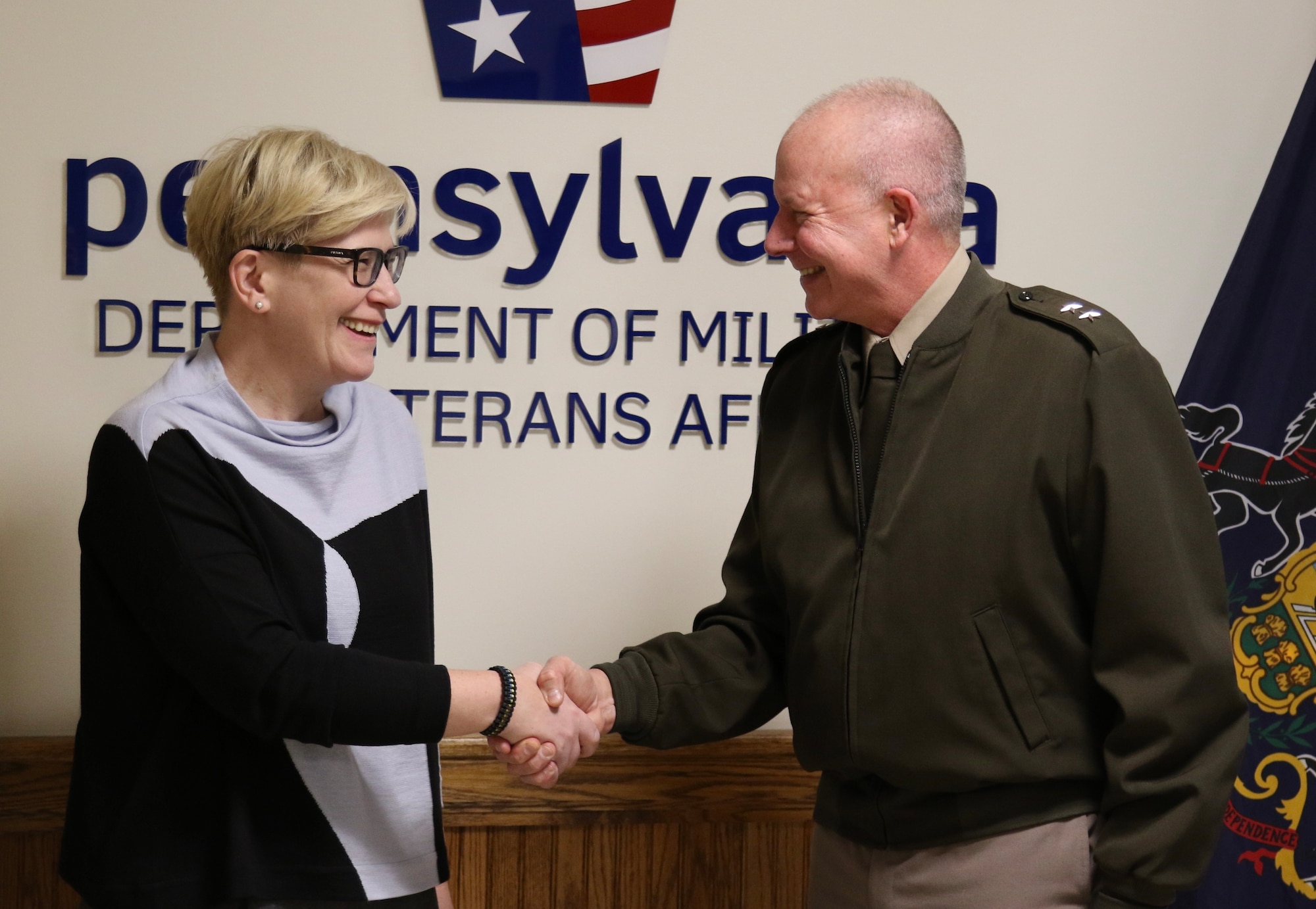 U.S. Army Maj. Gen. Mark Schindler, the adjutant general of Pennsylvania, welcomes the prime minister of Lithuania, Ingrida Šimonytė, to Fort Indiantown Gap to tour the base and learn more about the Pennsylvania National Guard’s partnership with the Lithuanian Armed Forces.