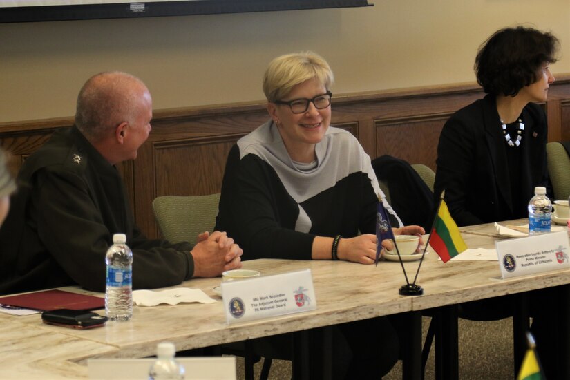 U.S. Army Maj. Gen. Mark Schindler, the Adjutant General of Pennsylvania, welcomes the Prime Minister of Lithuania, Ingrida Šimonytė, to Fort Indiantown Gap to tour the base and learn more about the Pennsylvania National Guard’s partnership with the Lithuanian Armed Forces.