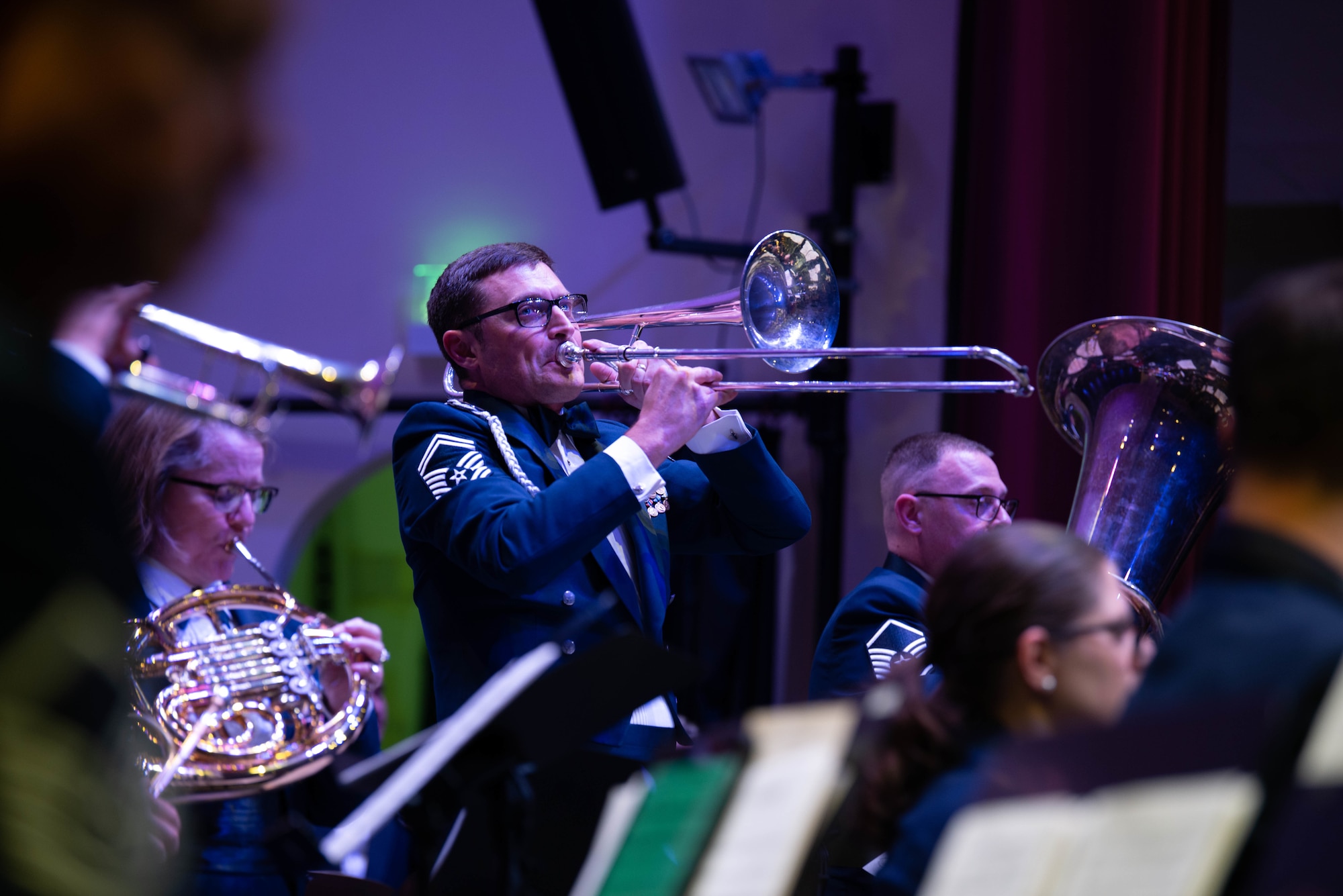 Musician plays trombone during a holiday concert