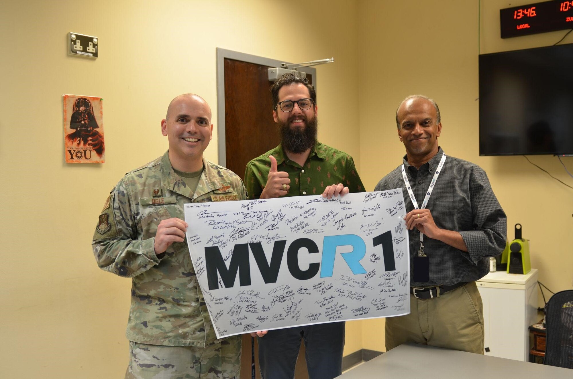 U.S. Air Force members and Kessel Run personnel celebrate the successful adoption of Kessel Run’s Minimum Viable Capability Release 1, at the 609th Air Operations Center Headquarters, Al Udeid Air Base, Qatar, Sept. 21, 2022. Kessel Run is a Division within Air Force Life Cycle Management Center’s Digital Directorate.