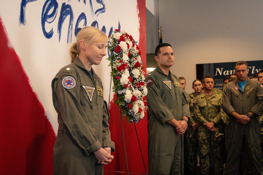 Capt. Edgardo Moreno, center, Naval Aviation Schools Command’s (NASC) commanding officer, and Cmdr. Brandy McNabb, left, NASC&#39;s executive officer, prepare to lay a wreath at a
remembrance ceremony for the victims of the Dec. 6 Naval Air Station (NAS) Pensacola terrorist attack, in the NASC Area of Remembrance, Dec. 6, 2022. The attack left three U.S. Navy Sailors dead and eight other personnel injured onboard NAS Pensacola, Dec. 6, 2019. NASC provides an educational foundation in technical training, character development, and professional leadership to prepare Navy, Marine Corps, Coast Guard and partner nation officers and enlisted students to be combat quality aviation professionals, and deliver them at the right time, in the right numbers, to be the forces their nation needs. (U.S. Navy photo by Ensign Harison Stevens)